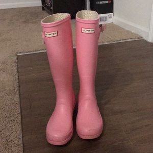 Tall, light pink Hunter boots
